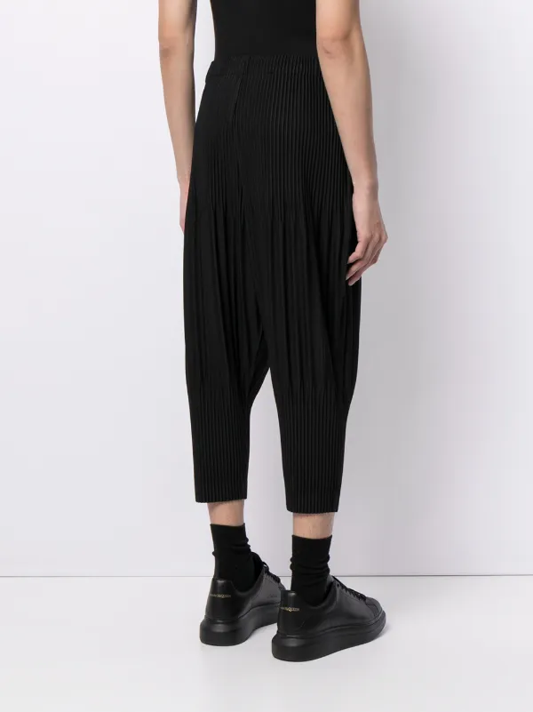 Shop Homme Plissé Issey Miyake tapered pleated trousers with