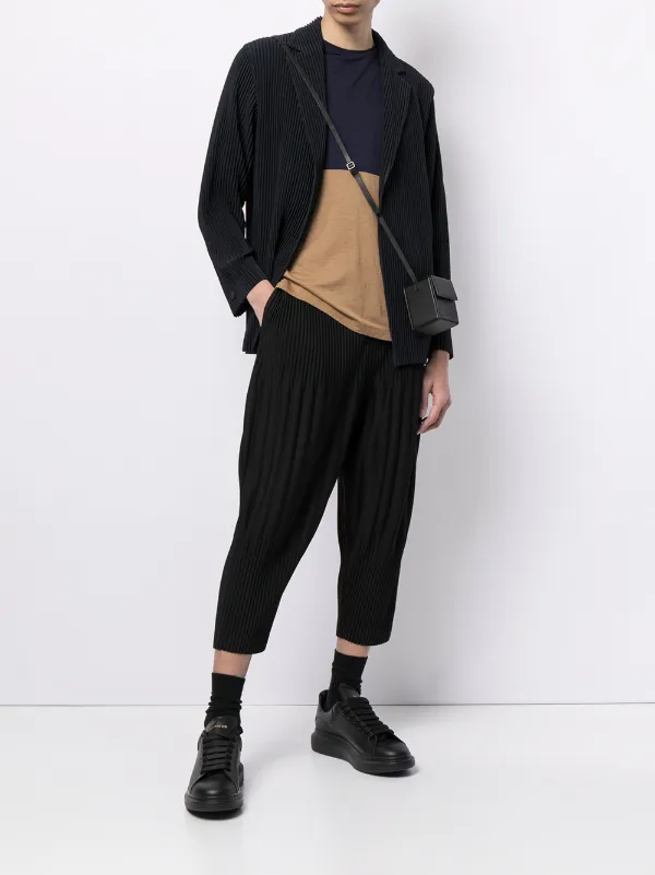 Shop Homme Plissé Issey Miyake tapered pleated trousers with