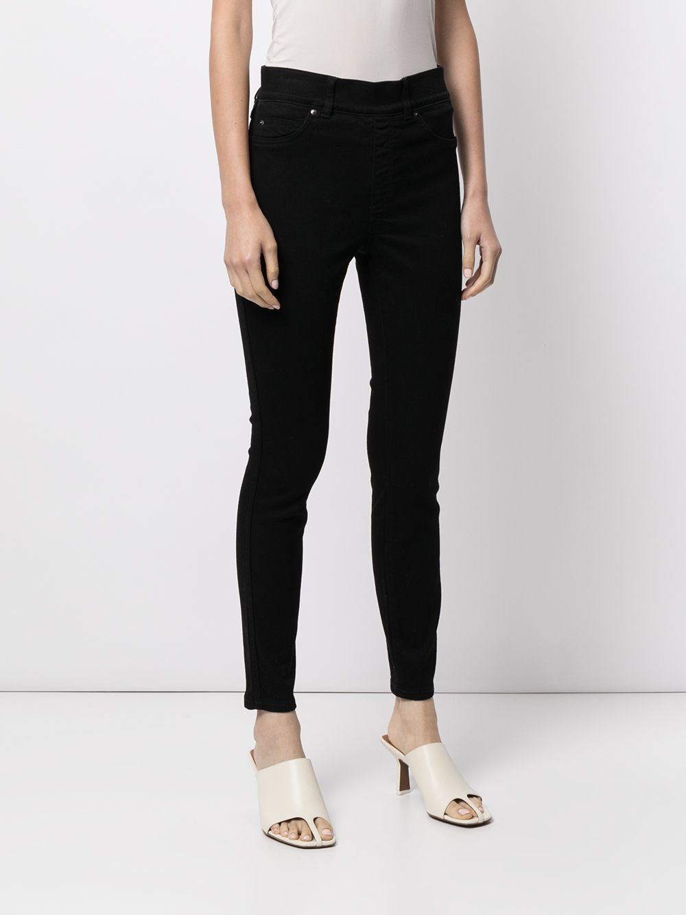 Shop Spanx Clean Mid-rise Skinny Jeans In Schwarz