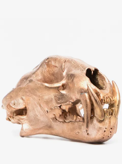 Parts of Four polished brass bone skull ornament
