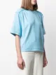 REMAIN playera con hombros capitonados