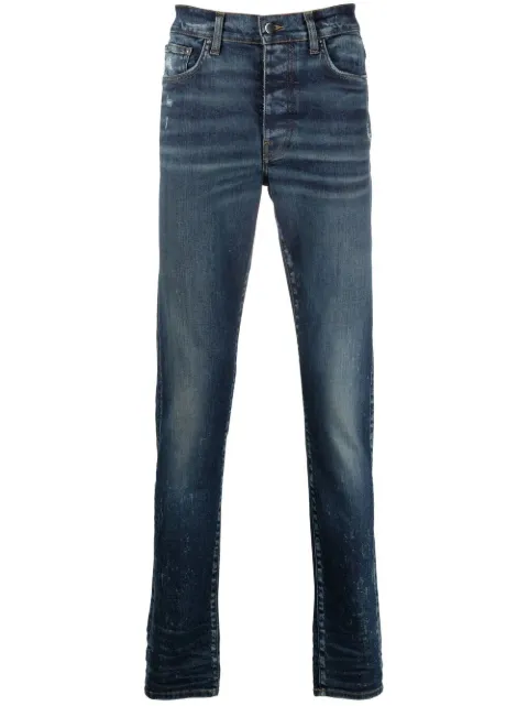 AMIRI jeans slim con efecto envejecido