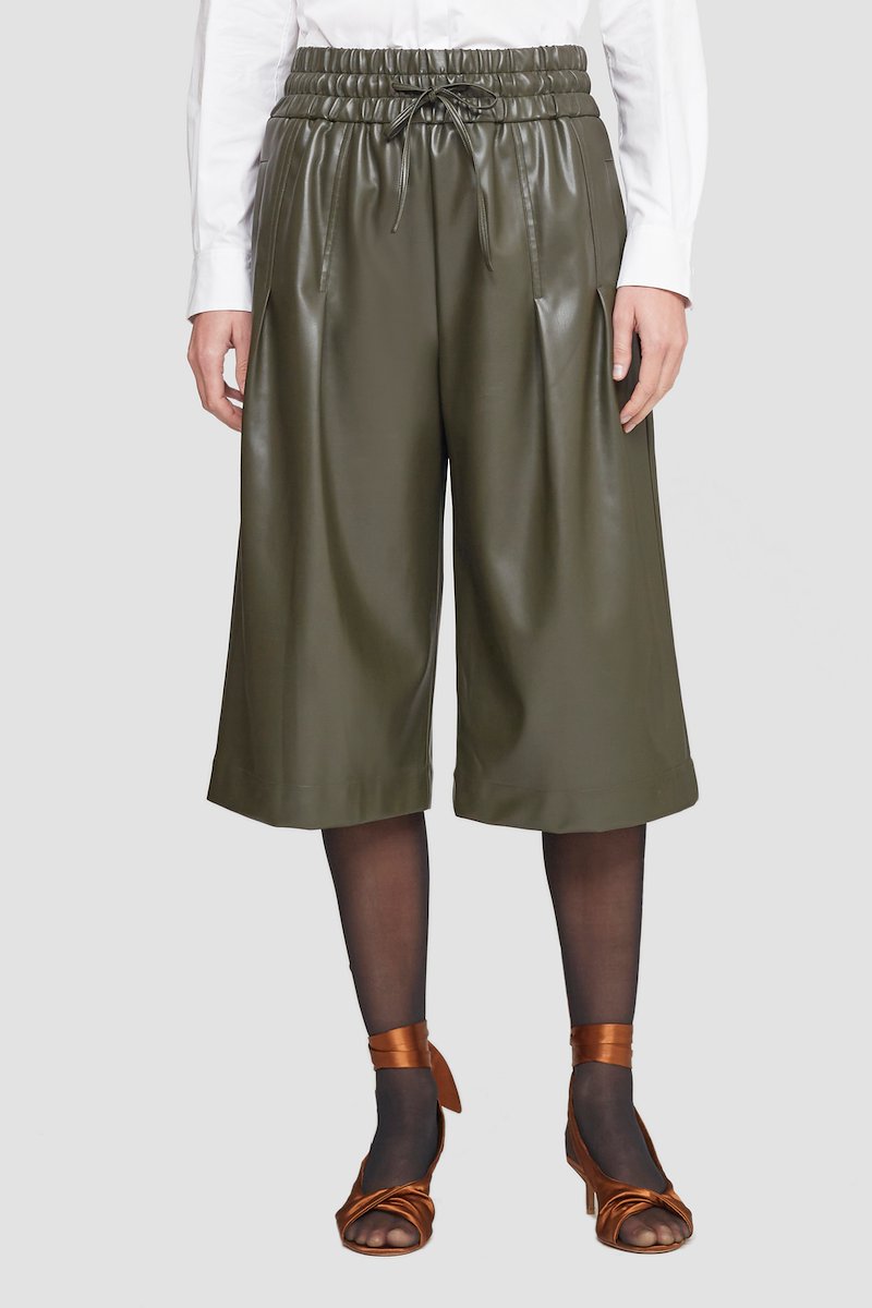 Leather Alternative Culottes-green #1 Leather Alternative Culottes, Dark green vegan leather box-pleat culottes from 3.1 PHILLIP LIM featuring faux-leather band, box-pleat detail, elasticated drawstring waistband, two side inset pockets, rear welt pocket, wide leg and cropped leg.- 1
