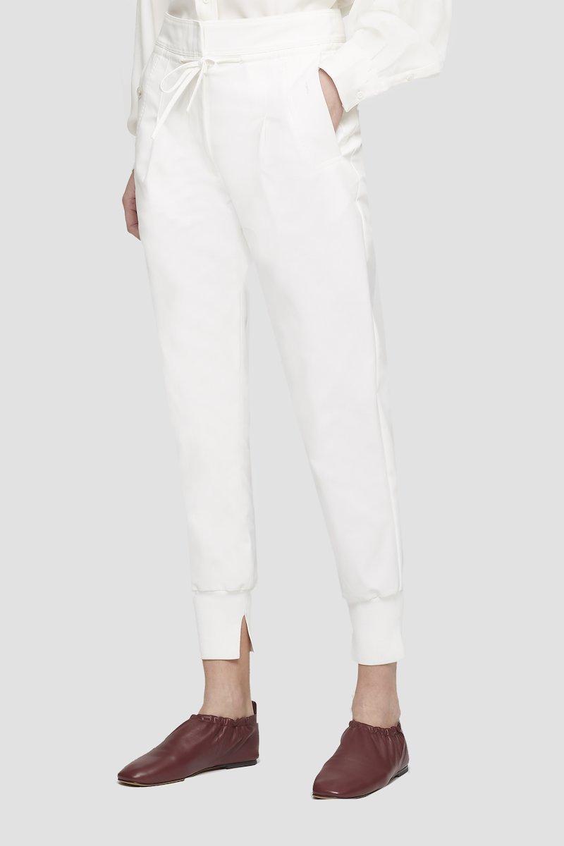 Tie Waist Utility Jogger-white #0 Tie Waist Utility Jogger, White cotton tapered track pants from 3.1 PHILLIP LIM featuring drawstring fastening waist, pleat detailing, two side slit pockets, tapered leg and tonal design.- 2