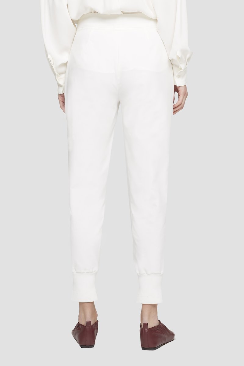 Tie Waist Utility Jogger-white #1 Tie Waist Utility Jogger, White cotton tapered track pants from 3.1 PHILLIP LIM featuring drawstring fastening waist, pleat detailing, two side slit pockets, tapered leg and tonal design.- 3