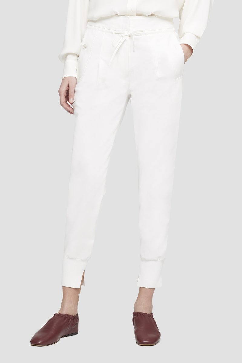 Tie Waist Utility Jogger-white #1 Tie Waist Utility Jogger, White cotton tapered track pants from 3.1 PHILLIP LIM featuring drawstring fastening waist, pleat detailing, two side slit pockets, tapered leg and tonal design.- 1