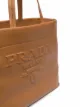Prada embossed-logo tote bag