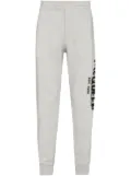 Alexander McQueen graffiti-print track pants - Grey