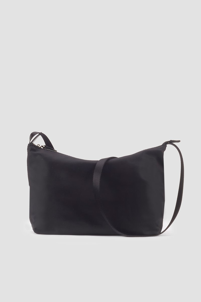 The Deconstructed Sling Bag-black #0 The Deconstructed Sling Bag, Black deconstructed utility sac crossbody bag from 3.1 PHILLIP LIM featuring logo patch to the side, top zip fastening and adjustable shoulder strap.- 0