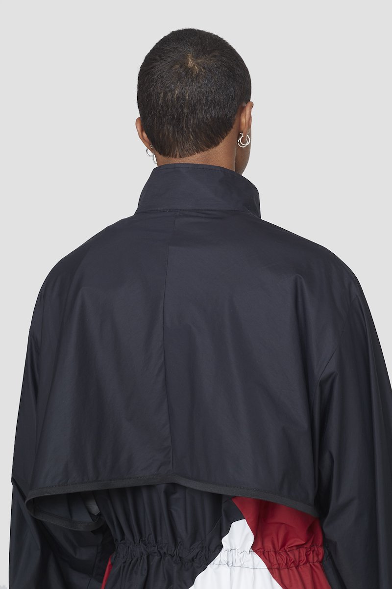 Fishtail Parka, colour-block drawstring parka from 3.1 PHILLIP LIM featuring black/red, cotton blend, colour-block design, stand-up collar, front press-stud and zip fastening, drawstring waist, long sleeves, cuff zips, two side inset pockets and fishtail design.- 7