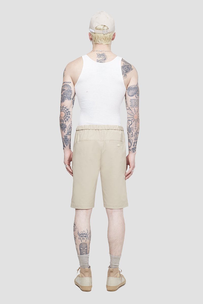 Kickin' It Short-neutrals #1 Kickin' It Short, Khaki beige Kickin It knee-length shorts from 3.1 PHILLIP LIM featuring logo patch to the side, elasticated drawstring waistband, two side slit pockets, two rear welt pockets and knee-length.- 3