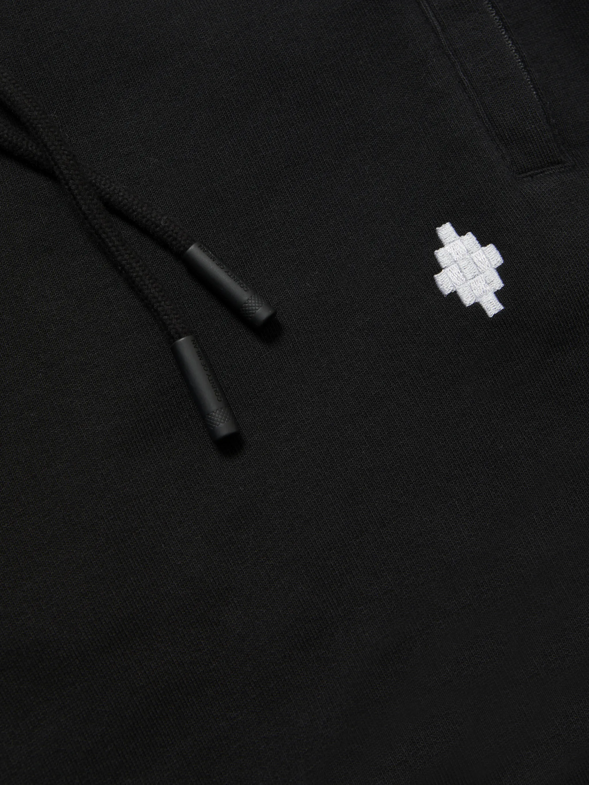 Black/white cotton logo-embroidered track pants from Marcelo Burlon County of Milan featuring embroidered logo to the front, elasticated waistband, two side slit pockets, rear welt pocket and elasticated ankles.