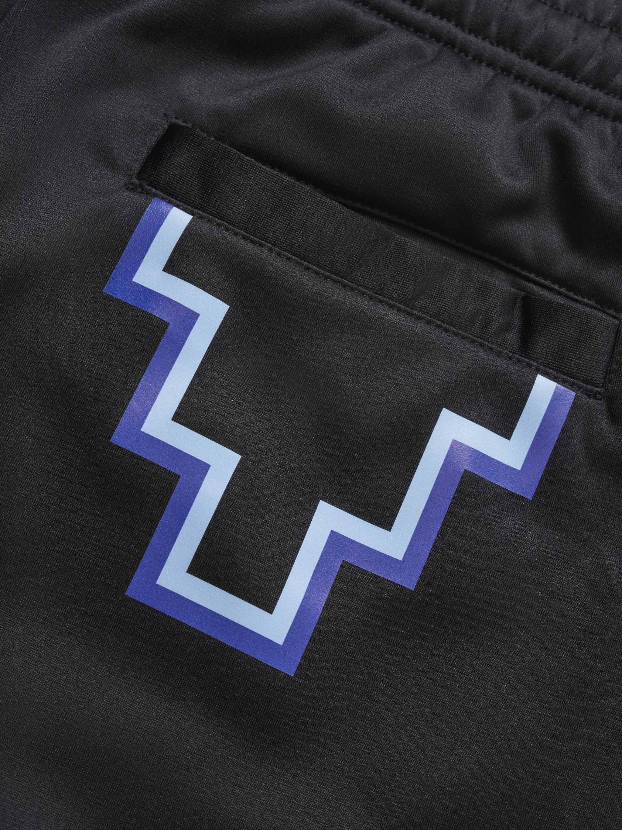 Black Cross logo track pants from Marcelo Burlon County of Milan featuring logo print to the rear, elasticated waistband, two side slit pockets and rear welt pocket.