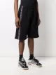 VETEMENTS logo-tape track shorts