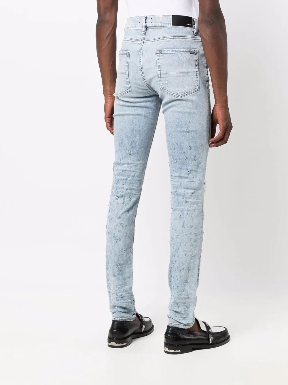 фото Amiri джинсы скинни с эффектом потертости