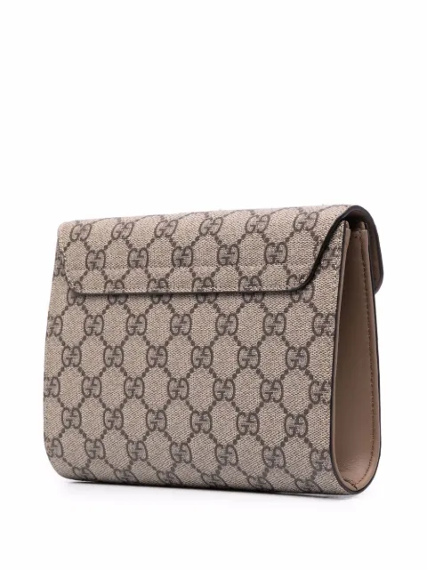 gucci supreme clutch