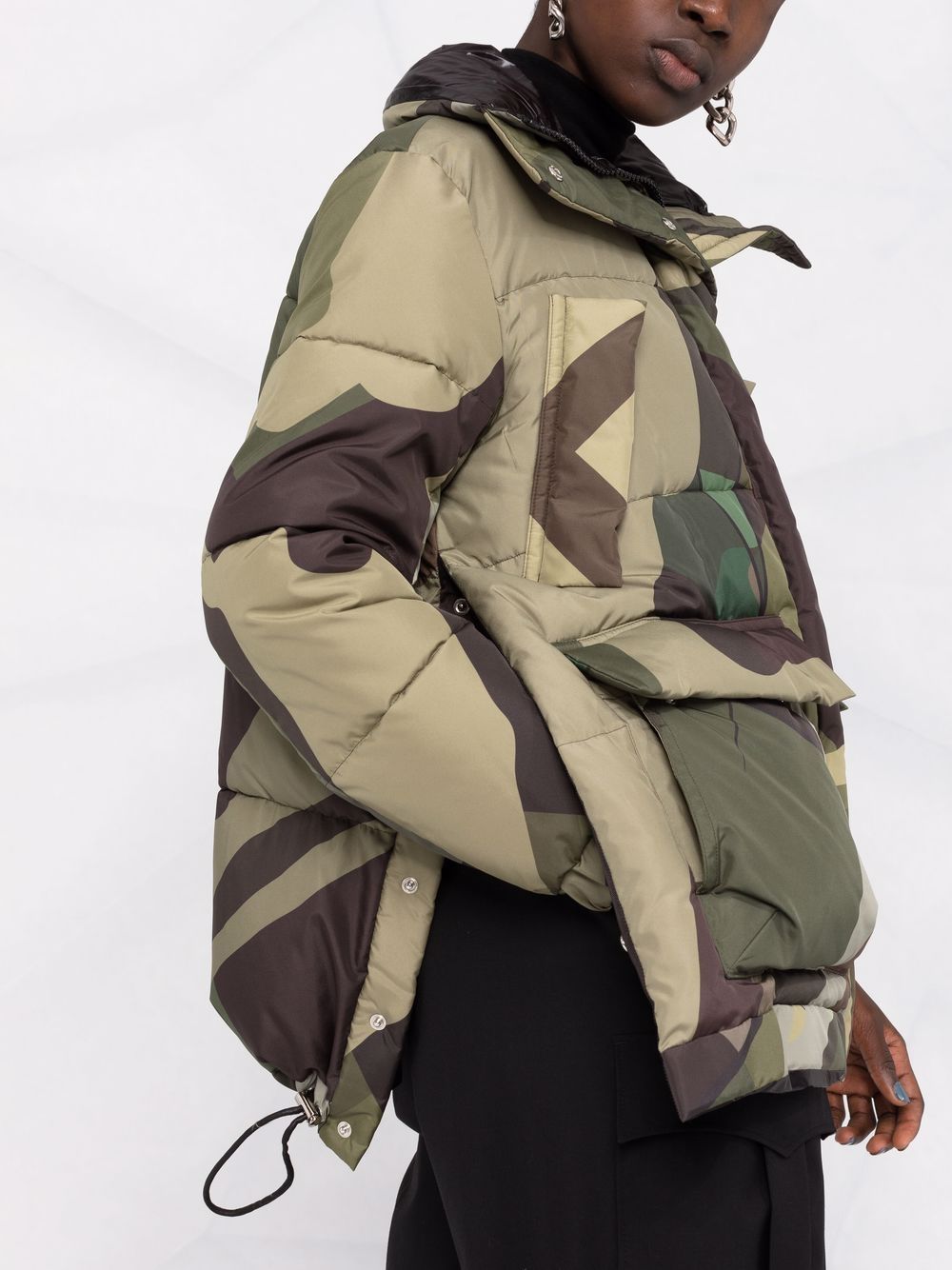 Sacai x KAWS camouflage-print Puffer Jacket - Farfetch
