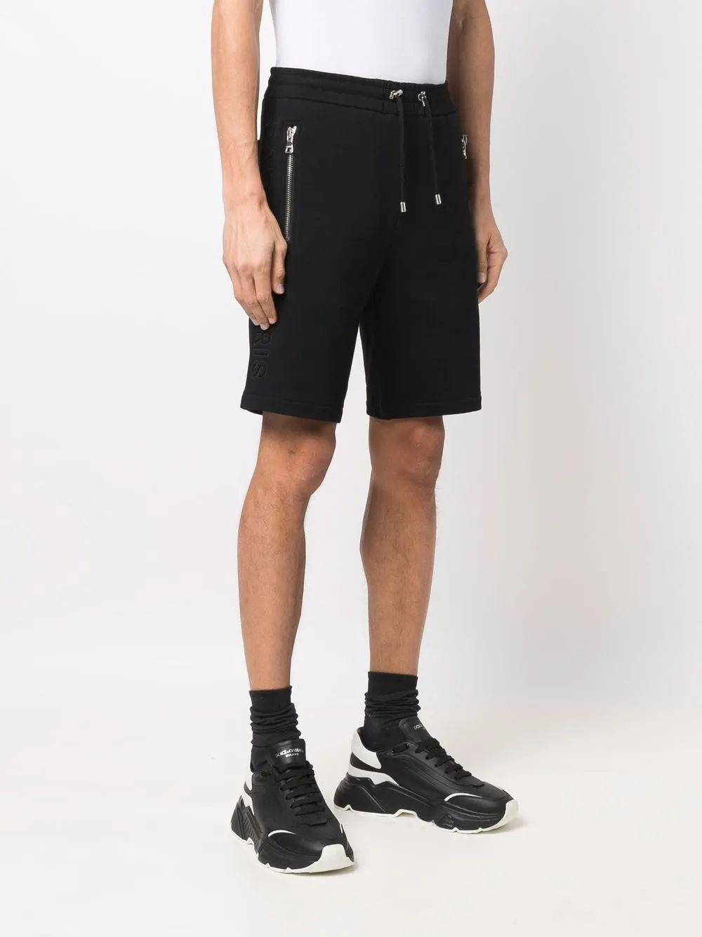 Balmain embossed logo Bermuda Shorts Farfetch