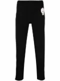 Alexander McQueen skull-patch slim-fit track pants - Black