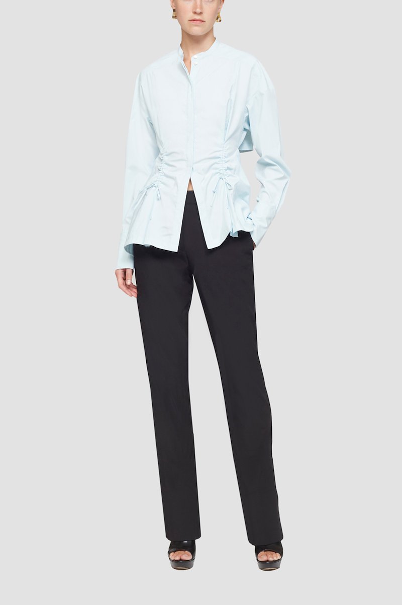 Ruched Tie Front Shirt with Open Back-blue #0 Ruched Tie Front Shirt with Open Back, draped peplum shirt from 3.1 PHILLIP LIM featuring ice blue, draped panel detail, cut-out detailing, lace-up detailing, band collar, concealed front fastening, long sleeves, buttoned cuffs and peplum hem.- 0