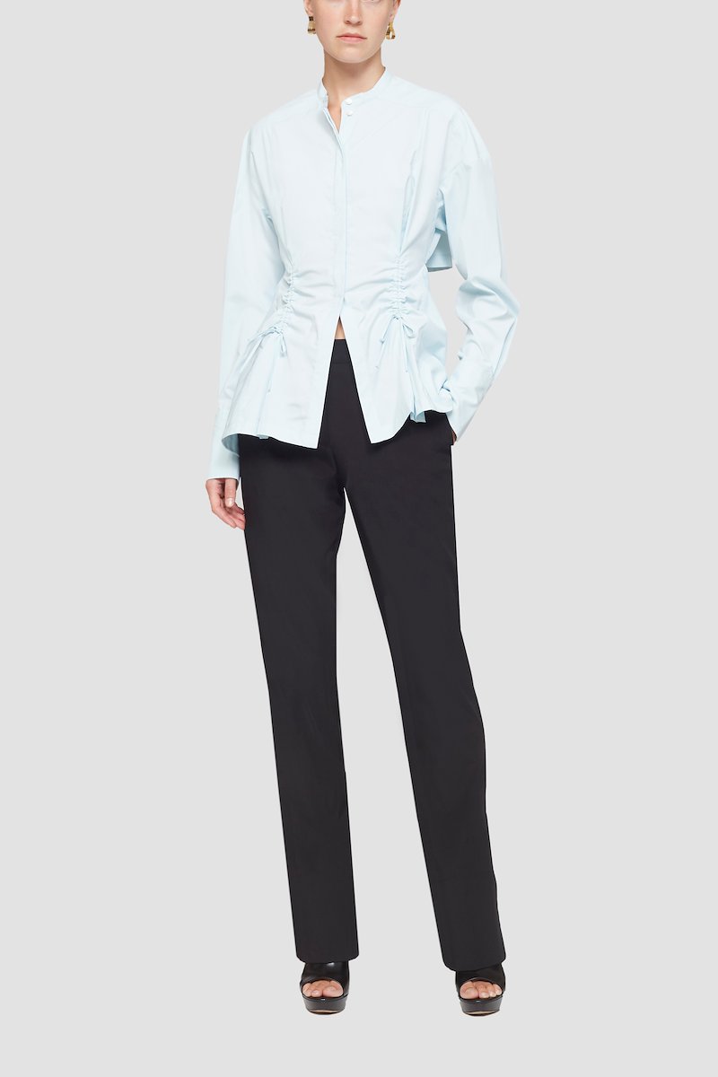 Ruched Tie Front Shirt with Open Back-blue #0 Ruched Tie Front Shirt with Open Back, draped peplum shirt from 3.1 PHILLIP LIM featuring ice blue, draped panel detail, cut-out detailing, lace-up detailing, band collar, concealed front fastening, long sleeves, buttoned cuffs and peplum hem.- 2