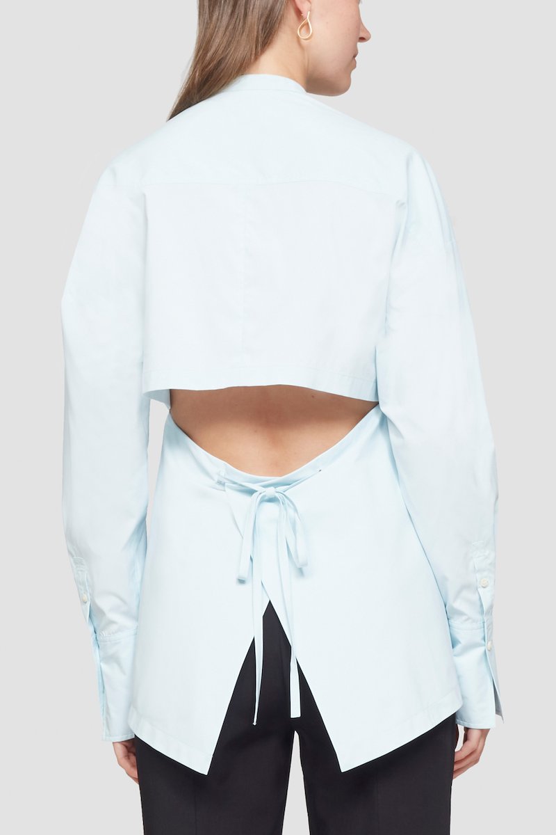 Ruched Tie Front Shirt with Open Back-blue #1 Ruched Tie Front Shirt with Open Back, draped peplum shirt from 3.1 PHILLIP LIM featuring ice blue, draped panel detail, cut-out detailing, lace-up detailing, band collar, concealed front fastening, long sleeves, buttoned cuffs and peplum hem.- 5