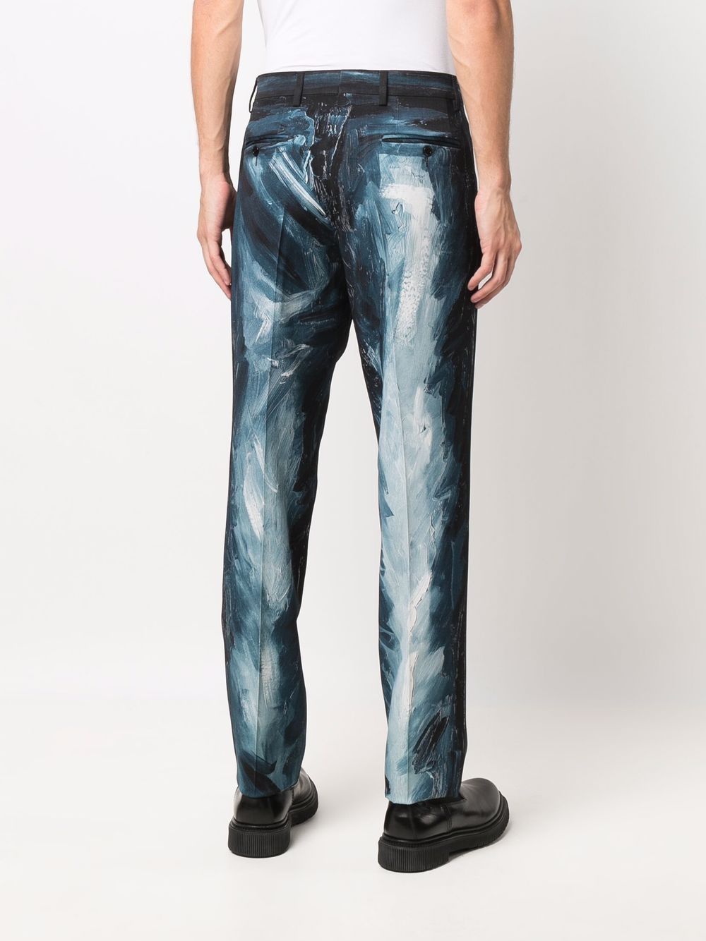 Shop Moschino Paint Stroke-print Trousers In Blue