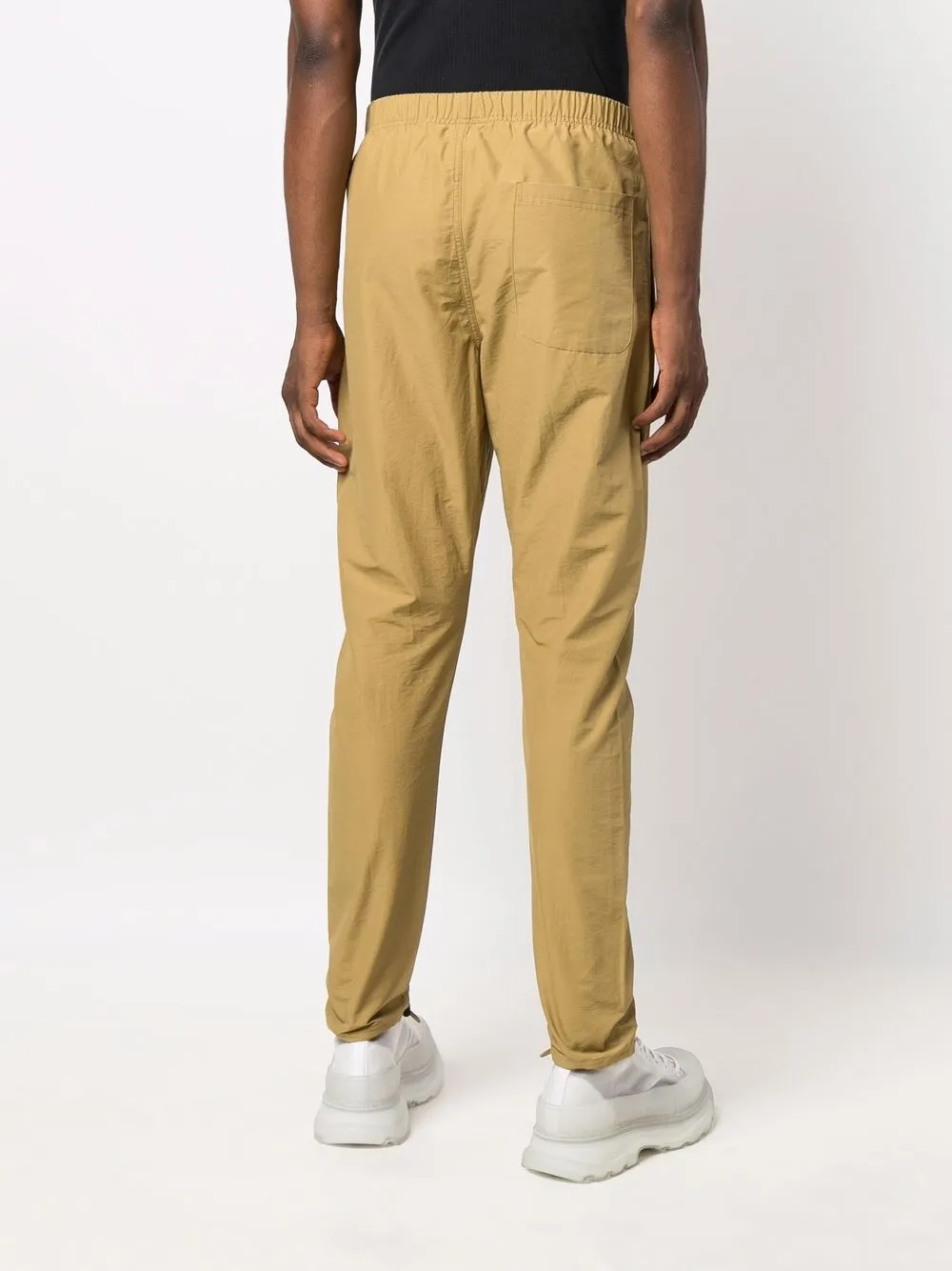 FEAR OF GOD ESSENTIALS Trainingsbroek met logoprint Beige