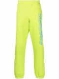 Moschino logo print joggers - Green