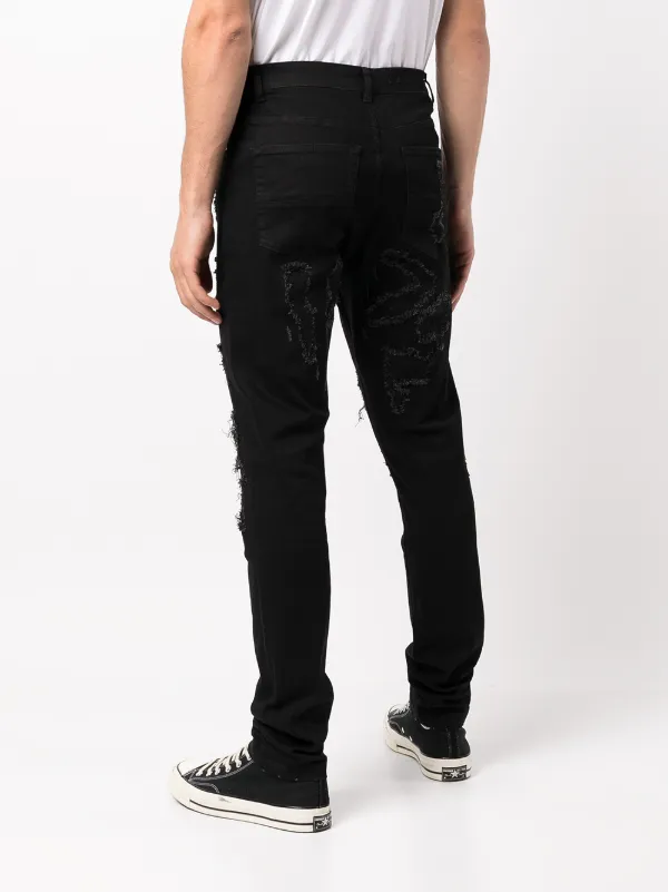 Billy the Kid ripped jeans