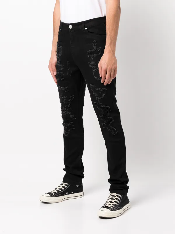 Billy the Kid ripped jeans