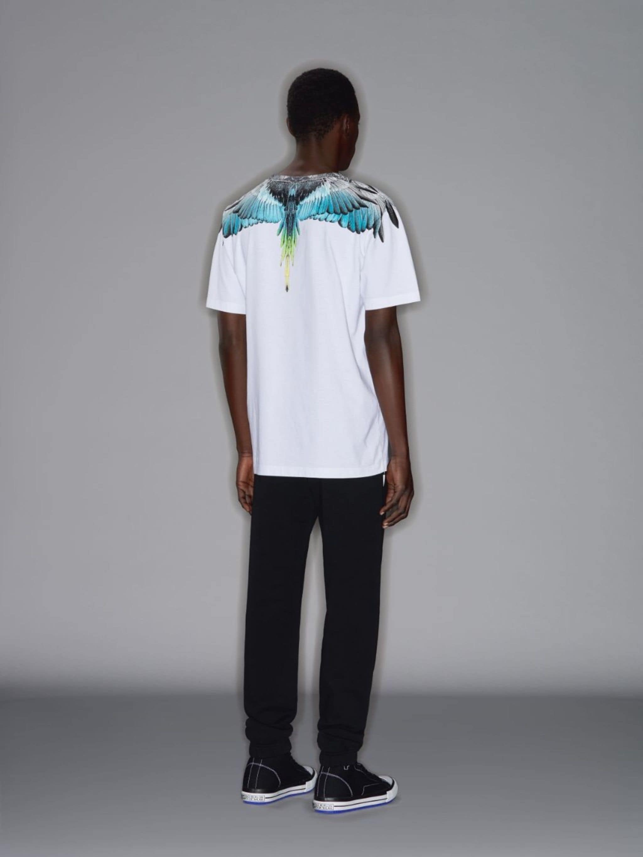 White cotton Wings print T-shirt from Marcelo Burlon County of Milan featuring round neck, jersey knit, straight hem and short sleeves.
