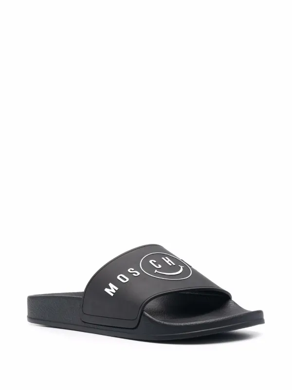 Shop Moschino logo smiley face slides with Express Delivery - FARFETCH Shop Moschino logo smiley face slides with Express Delivery - FARFETCH