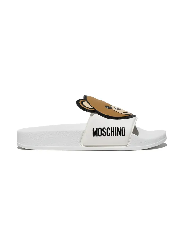 white moschino slides