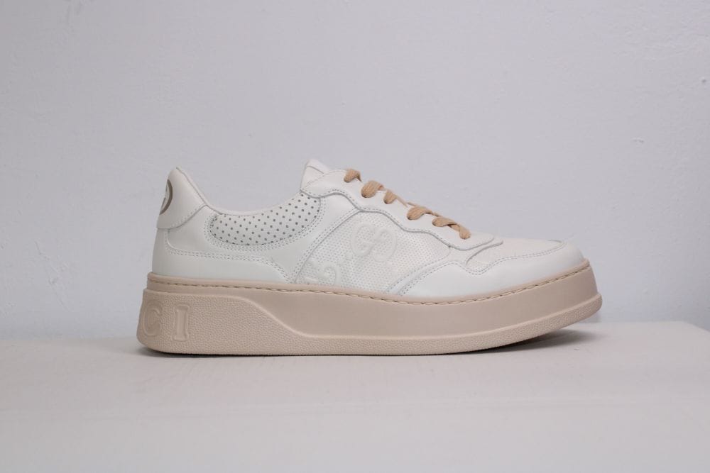 Gucci GG Embossed low-top Sneakers - Farfetch