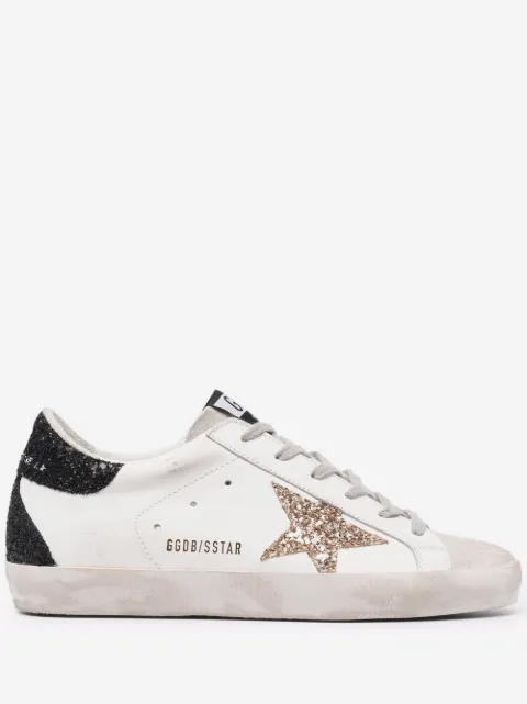 Golden Goose Super-Star trainers in nappa leather with gold glitter star and black glitter heels tab