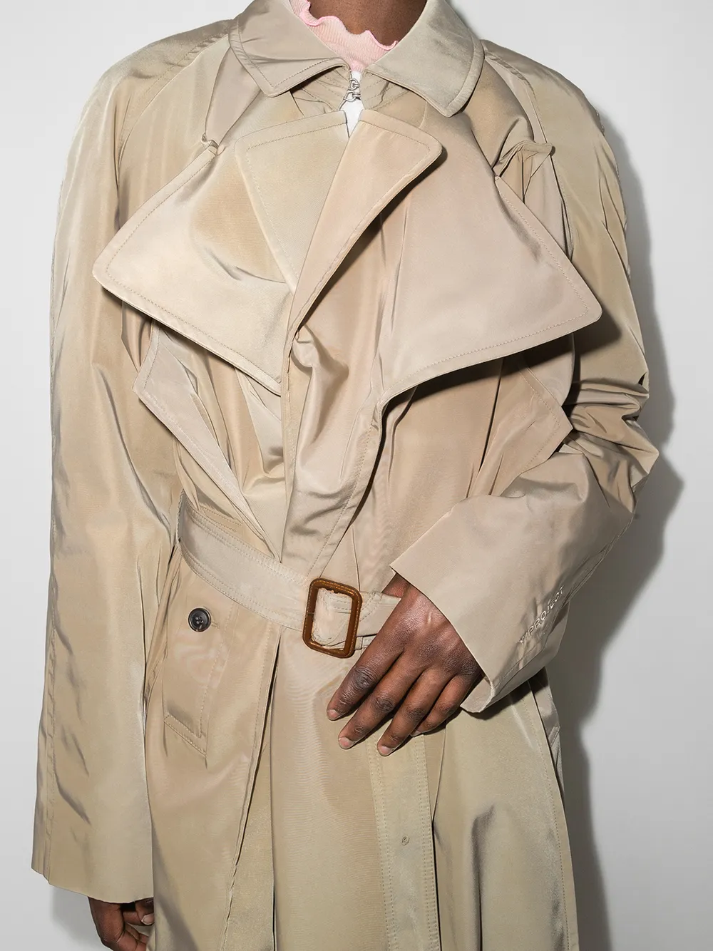 layered belted trench coat