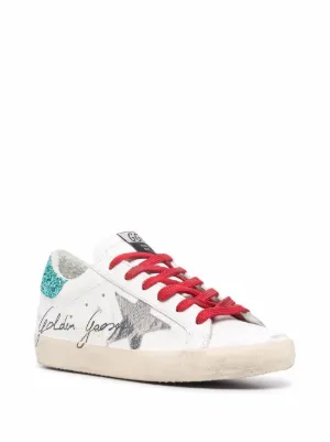 golden goose with red laces