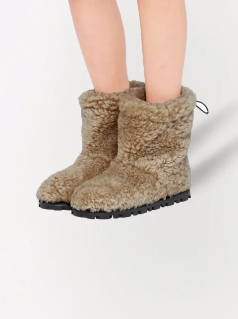 Shop Miu Miu shearling ankle boots with Express Delivery - FARFETCH