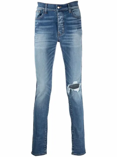 ripped-detail denim jeans | AMIRI 