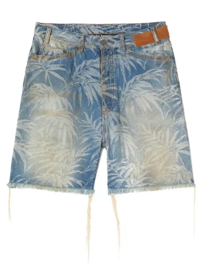 leaf-print distressed denim shorts 