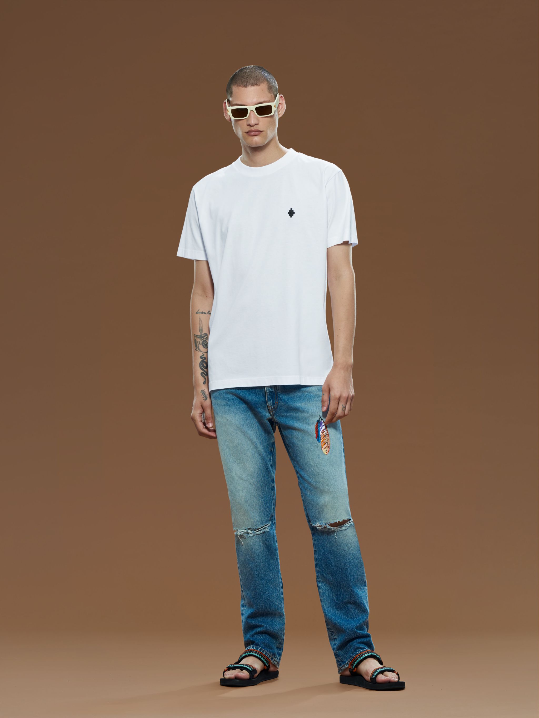 White cotton Cross-logo embroidered cotton T-shirt from Marcelo Burlon County of Milan featuring signature Cross motif, embroidered logo at the chest, round neck, short sleeves and straight hem. Conscious: This item is made from at least 50% organic materials.