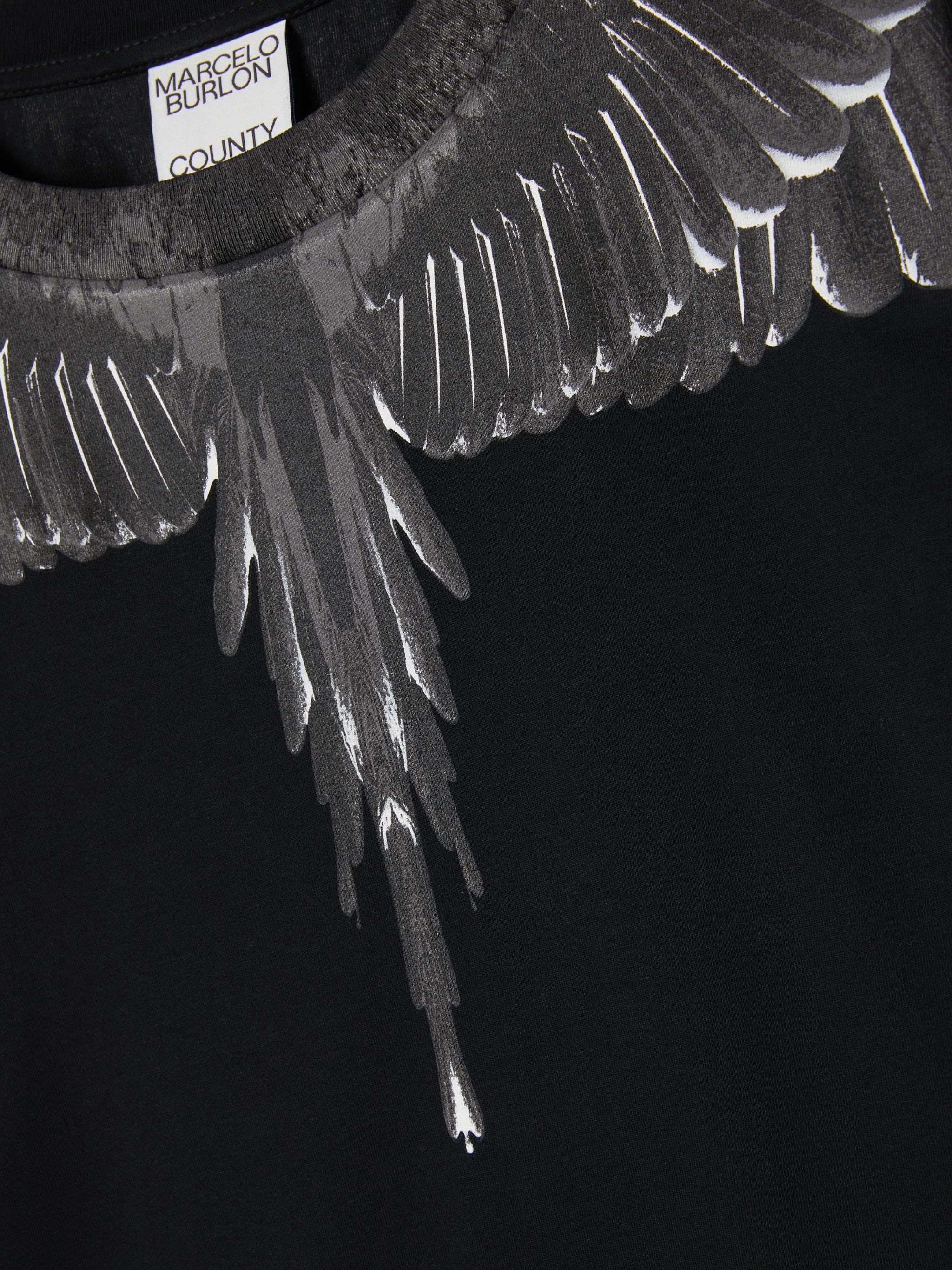 Wings-print cotton T-shirt from Marcelo Burlon County of Milan featuring black, signature Marcelo Burlon Wings print, round neck, short sleeves, straight hem and cotton. Conscious: This item is made from at least 50% organic materials.