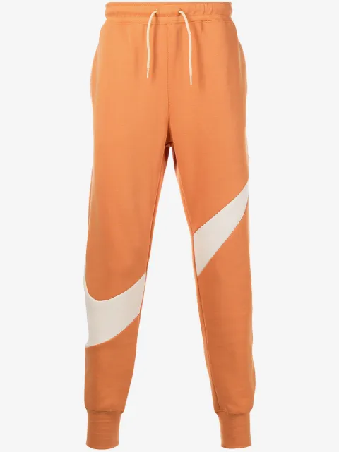Nike pantalon de jogging en polaire à imprimé Swoosh