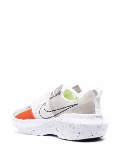 cream and orange nike shoes