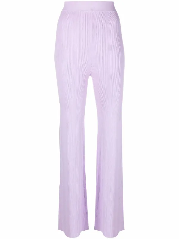 Shop REMAIN ribbed-knit flared trousers 