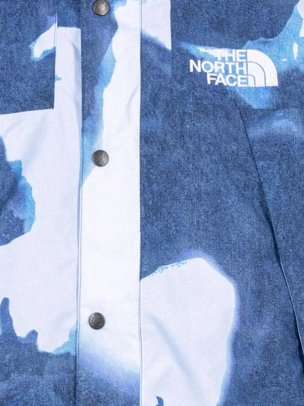 x The North Face bleached denim-print mountain jacket