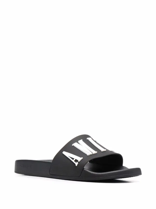 Shop AMIRI debossed logo slides with 