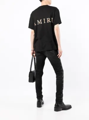 Nuova collezione di T-shirt e canotte di Amiri da uomo su FARFETCH