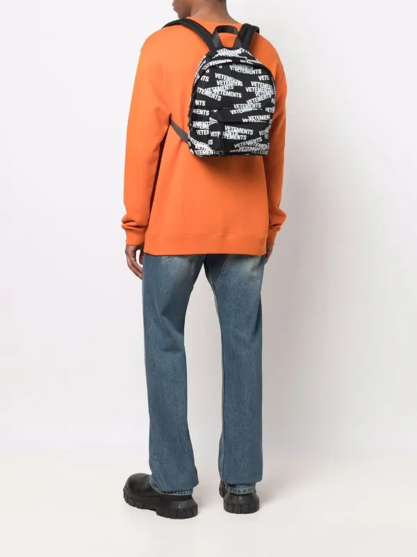 VETEMENTS logo-print Backpack | Black | FARFETCH
